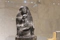 Granite sculpture Senenmut holding Hatshepsut`s daughter Neferura on display in the NMEC, Cairo, Egypt.