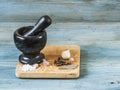 Stone mortar with a pestle on a wooden cutting board Royalty Free Stock Photo