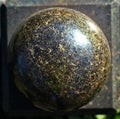 Granite stone polished ball on a granite slab Royalty Free Stock Photo