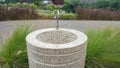 A granite stone round wash basin in the garden Royalty Free Stock Photo