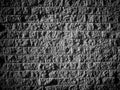Granite stone wall background texture black white old stone siding with different sized stones dark