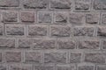 Granite wall made of blocks with rustication Royalty Free Stock Photo