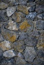 Granite stones of different shapes and colors. Wall cladding. Background selective focus with copy space. 2 Royalty Free Stock Photo