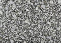 Granite surface featuring a coarse-grained texture composed of interlocking crystals. Predominantly Royalty Free Stock Photo