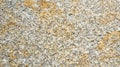 Granite surface showcasing natural patterns and textures in warm tones from a close-up view Royalty Free Stock Photo