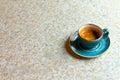 Granite table with blue modern coffee cup. Top view with copy space. Flat lay. Place for text. Modern coffe background