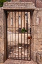 Granite wall and entry with iron barred gate