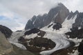 Granite walls of Block peak and a glacier in clouds