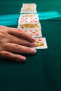 Old woman hands playing cards in home Royalty Free Stock Photo