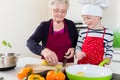 Granny cooking together with her grandson Royalty Free Stock Photo