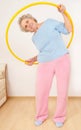 Granny doing gymnastic with hula-hoop Royalty Free Stock Photo