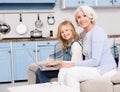 Granny and little girl using laptop Royalty Free Stock Photo