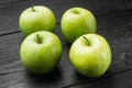 Granny smith apple, on black wooden table background Royalty Free Stock Photo