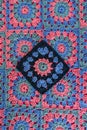 Granny square in black color as main placed on crochet afghan Royalty Free Stock Photo