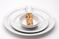 Granola bar on bland white serving dishes