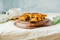 Granola bar cake with date caramel and chocolate. Healthy sweet dessert snack. Cereal granola bar with nuts, fruit and berries on Royalty Free Stock Photo