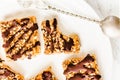 Granola bar cake with date caramel and chocolate. Healthy sweet dessert snack. Cereal granola bar with nuts, fruit and berries on Royalty Free Stock Photo