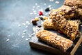 Granola bar with nuts, fruit and berries on black. Royalty Free Stock Photo