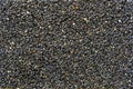 Granola bar. Healthy sweet dessert snack. Black sesame seeds with honey in background, close up Royalty Free Stock Photo