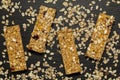 Granola bar. Healthy sweet dessert snack. Cereal granola bar with nuts, fruit and berries on a black stone table. Royalty Free Stock Photo