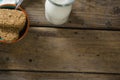 Granola bar and milk on wooden table Royalty Free Stock Photo