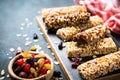 Granola bar with nuts, fruit and berries on black. Royalty Free Stock Photo