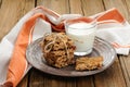 Granola bars with glass of milk on wooden background Royalty Free Stock Photo