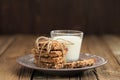 Granola bars with glass of milk on wooden background Royalty Free Stock Photo