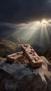 Granola bars with nuts and berries on a rock under dramatic mountain sky Royalty Free Stock Photo