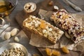 Granola bars with nuts and dried fruits and honey on wooden background- snack for healthy still live Royalty Free Stock Photo