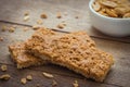 Granola bars on wooden table and peanuts Royalty Free Stock Photo