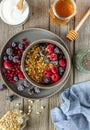 Granola with berries, yoghurt and honey. Raspberries, blueberries, currants Royalty Free Stock Photo