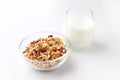granola cereal in bowl with milk isolated on white background Royalty Free Stock Photo