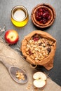 Granola, dried berries, apples and honey. Royalty Free Stock Photo