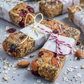 Granola energy bars with figs, oatmeal, almond, dry cranberry, chia and sunflower seeds, square format Royalty Free Stock Photo