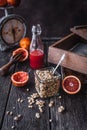 Granola and fresh pomegranates fruit on wooden tabletop