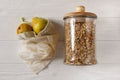 granola in glass and eco natural bags with fruits, flat lay. plastic free items. reuse, reduce, recycle, refuse. bulk store.
