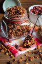 Granola in glass jar on rustic background