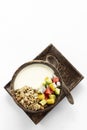 Granola muesli healthy breakfast bowl with yogurt and tropical fruit Royalty Free Stock Photo