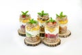 Granola, slices of different fresh fruits, yogurt, honey in jars isolated on white background. Royalty Free Stock Photo