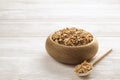 Granola superfood with almond and cashew nuts, dry fruits, raisins cherry in wooden bowl on the white wooden table, top view, brig Royalty Free Stock Photo