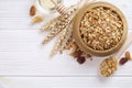 Granola superfood with almond and cashew nuts, dry fruits, raisins cherry in wooden bowl on the white wooden table, top view, brig Royalty Free Stock Photo