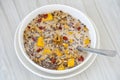 Granola with yellow mango, red goji berries and almond milk, closeup Royalty Free Stock Photo