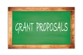 GRANT PROPOSALS text written on green school board