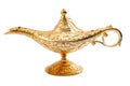 Grant a wish, desiring financial wealth with a old golden magic lamp isolated on white background with clipping path Royalty Free Stock Photo