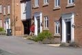 Royal mail worker delivering parcel