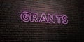 GRANTS -Realistic Neon Sign on Brick Wall background - 3D rendered royalty free stock image