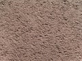 Granular texture of dry compacted earth light gray-brown beige color Royalty Free Stock Photo