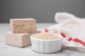 Granulated and compressed yeast on white marble table, closeup