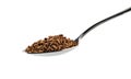 Granulated instant coffee on metal spoon isolated on white Royalty Free Stock Photo